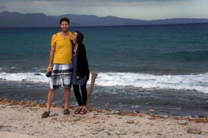 Couple standing on a beach by the sea