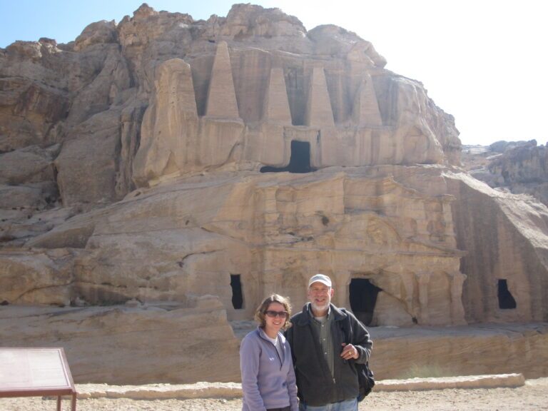 David Richman and a companion in front of ancient rock-cut tombs