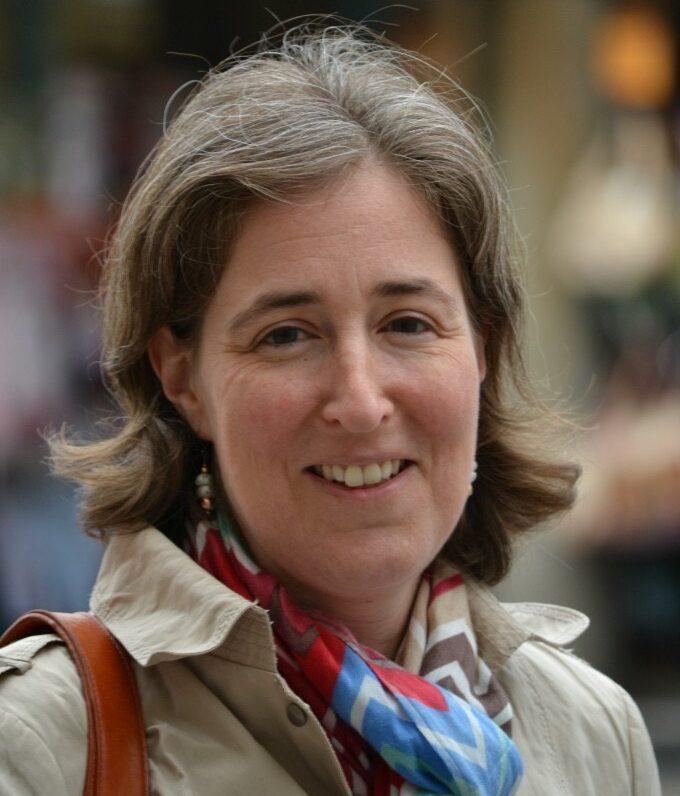 Portrait of a smiling woman with a scarf
