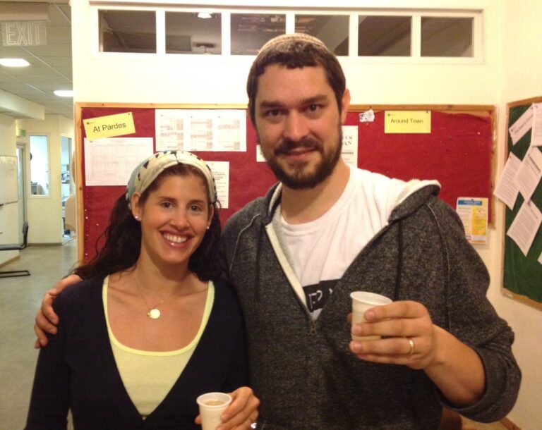 Rachel Barenbaum and Adam Kleinbaum smiling in a classroom