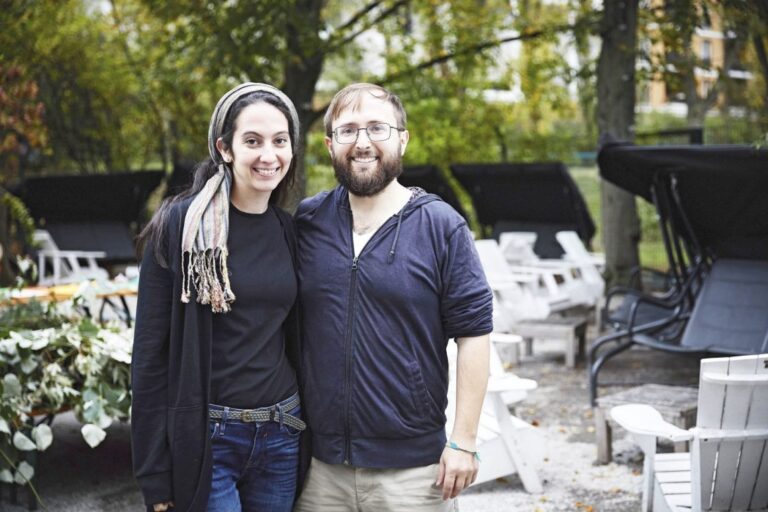 Smiling couple standing together outdoors